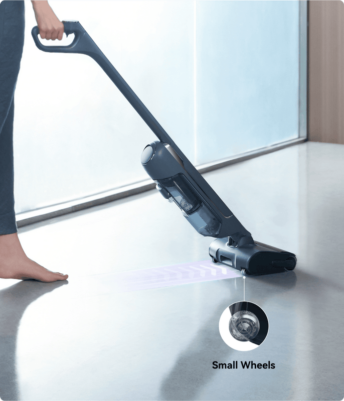 The person is using the Narwal s20 pro vacuum mop with small wheels.
