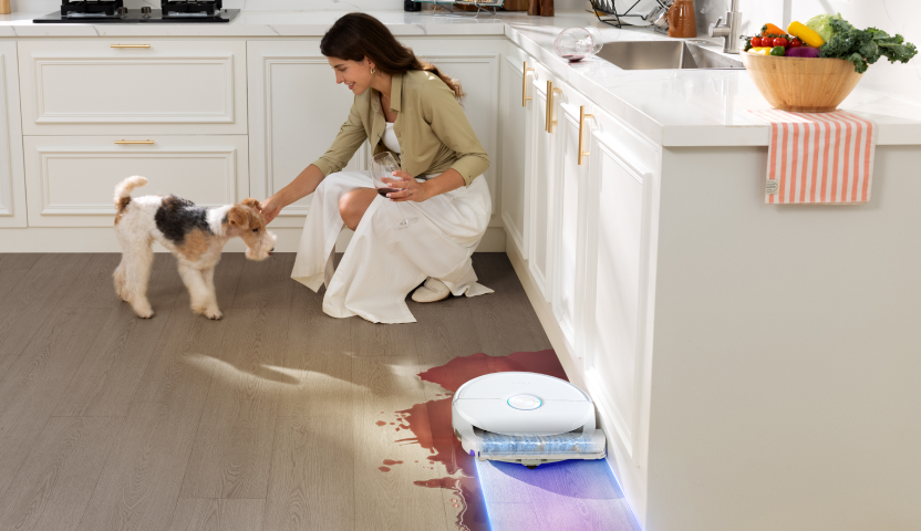 Narwal R32 mopping a kitchen floor along baseboards