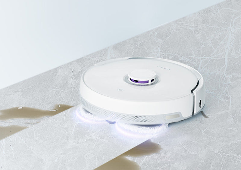 Narwal Freo Versatile Self Mop Clean Robot cleaning a smooth surface with its rotating mops, showing a clean and effective performance.