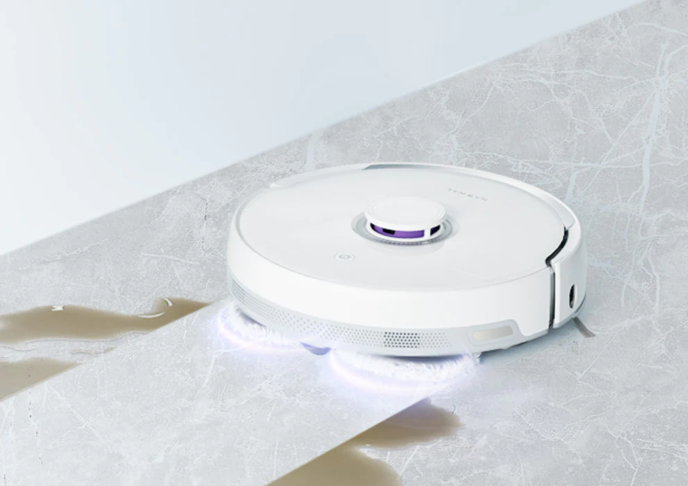 Narwal Freo Versatile Self Mop Clean Robot cleaning a smooth surface with its rotating mops, showing a clean and effective performance.