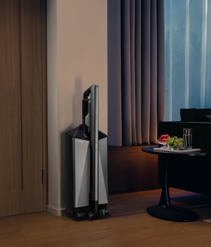 Narwal V50 Cube station beside curtains in a dim living room