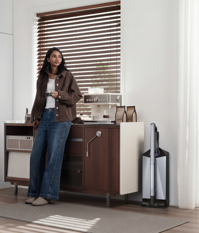 Narwal V50 Cube station beside a coffee bar and a woman