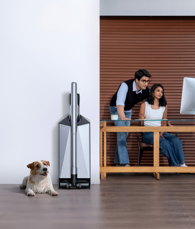 Narwal V50 Cube station beside a home office and dog