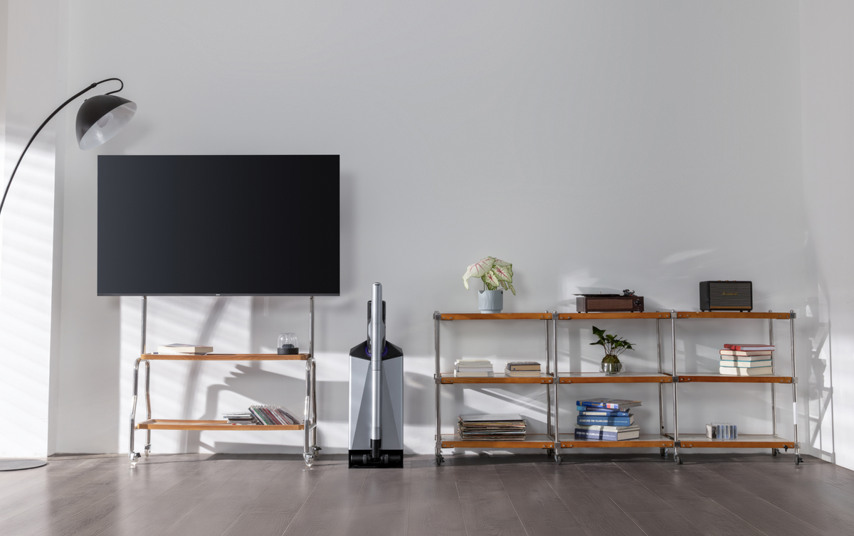 Narwal V50 Cube station beside a TV and shelving