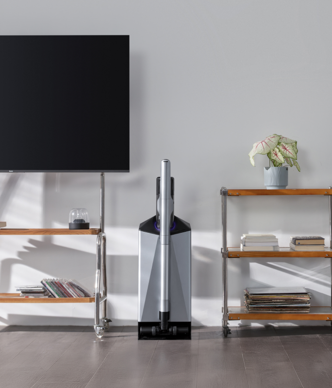 Narwal V50 Cube station beside a TV and shelving